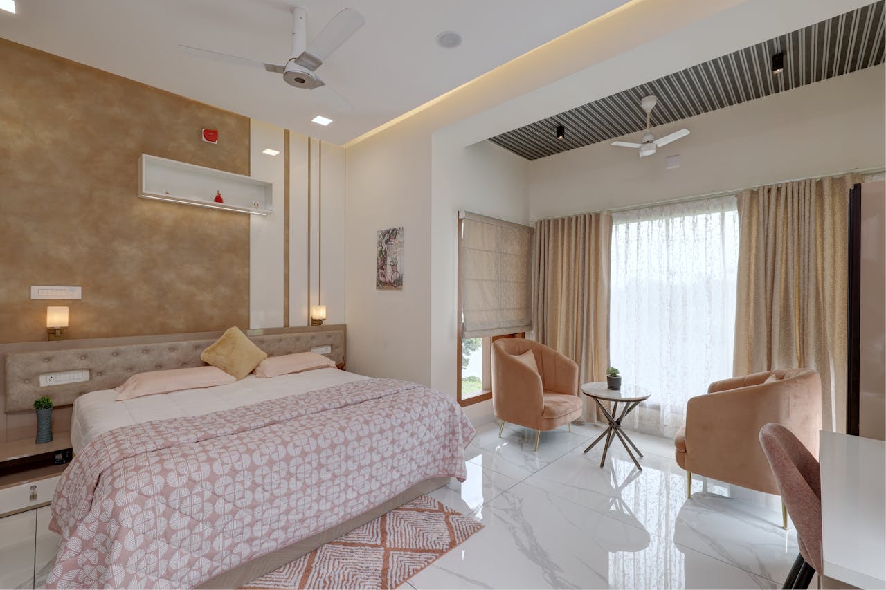 services-04 Spacious and elegant bedroom with modern design and decor in Aluva, Kerala.